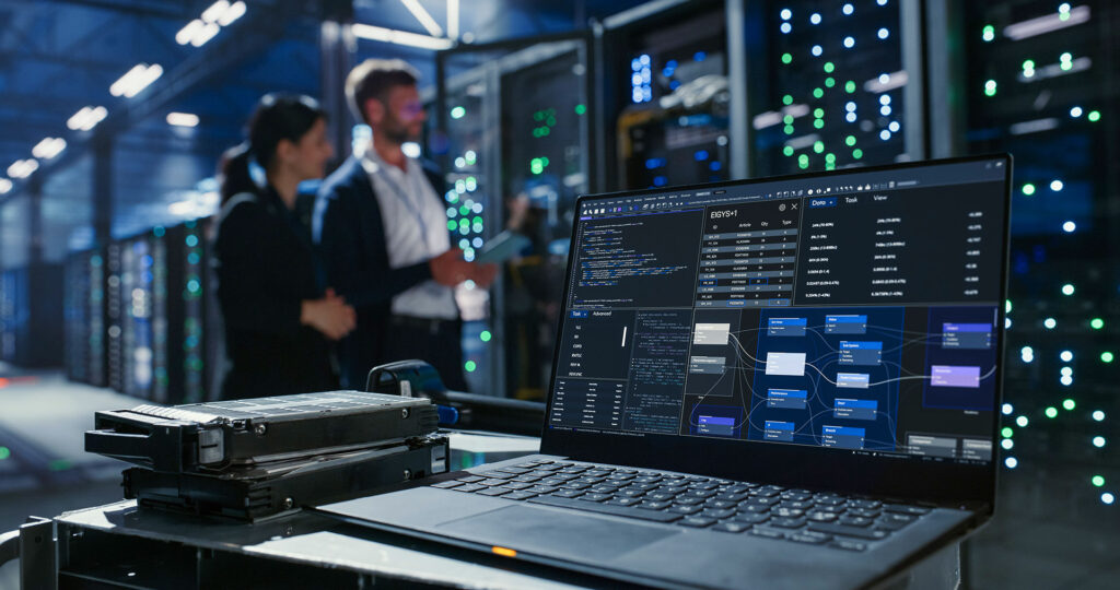 IT engineer laptop showing network diagram on server room cart in data center
