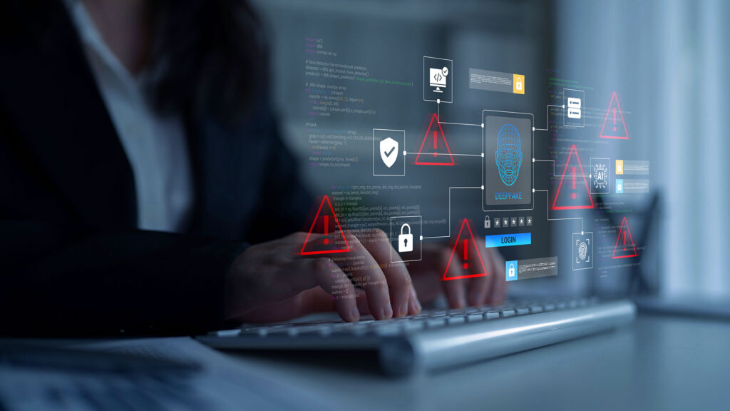 Cybersecurity warning icons overlaying hands typing on office keyboard